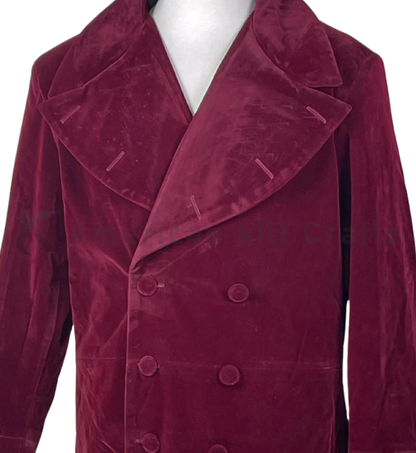 Close-up of a maroon velvet sci-fi frock coat showing the rich velvet texture, double-breasted buttons, lapel detailing and tailored craftsmanship.