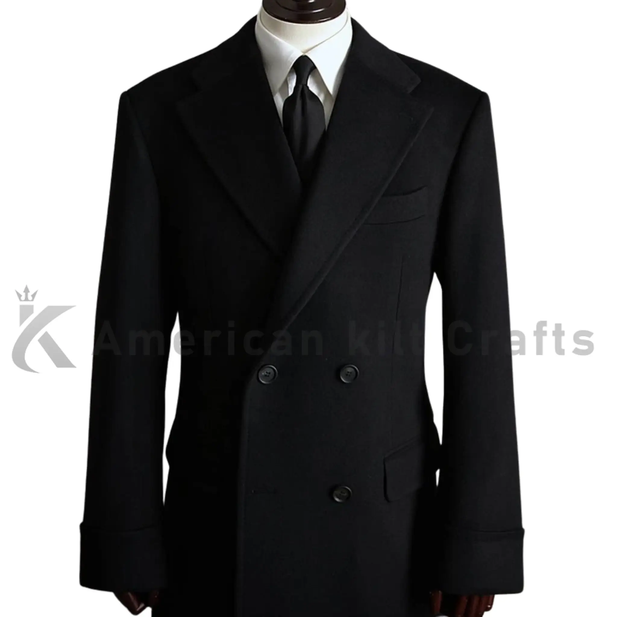 Close-up of men’s black greatcoat showing the heavyweight fabric, double-breasted button front, structured lapels, and tailored winter coat details.