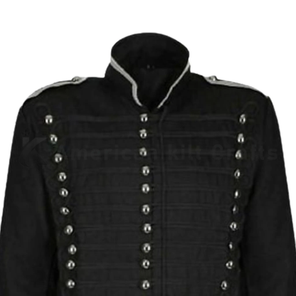 Close-up of men’s black Hussar military jacket featuring brass buttons, epaulettes, decorative trim and detailed craftsmanship.