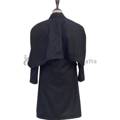 Back view of a men’s black wool Inverness cape coat showing the flowing cape back, structured shoulders and long Victorian overcoat silhouette.