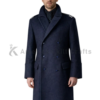 Close-up of men’s blue wool long coat showing the wool fabric texture, double-breasted buttons, lapel, stitching, and military-inspired tailoring.