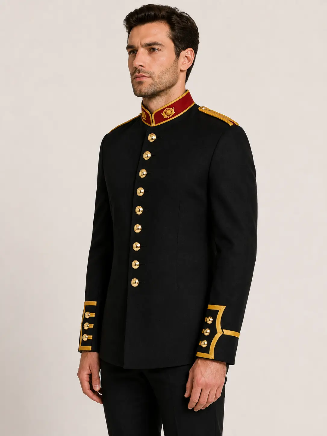 Side angle view of men's black wool British Royal Marines-inspired military parade jacket with gold trim and red stand collar.