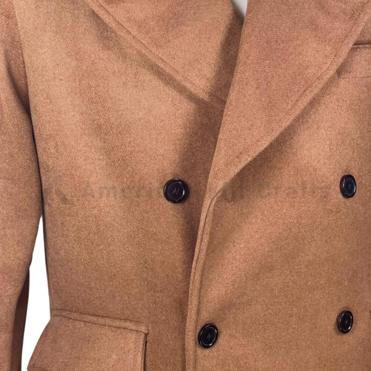 Close-up of men’s camel wool overcoat highlighting the double-breasted buttons, tailored lapels, wool texture, and British military-inspired detailing.