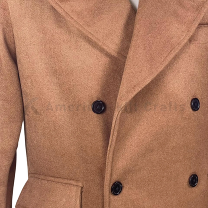 Close-up of men’s camel wool overcoat highlighting the double-breasted buttons, tailored lapels, wool texture, and British military-inspired detailing.