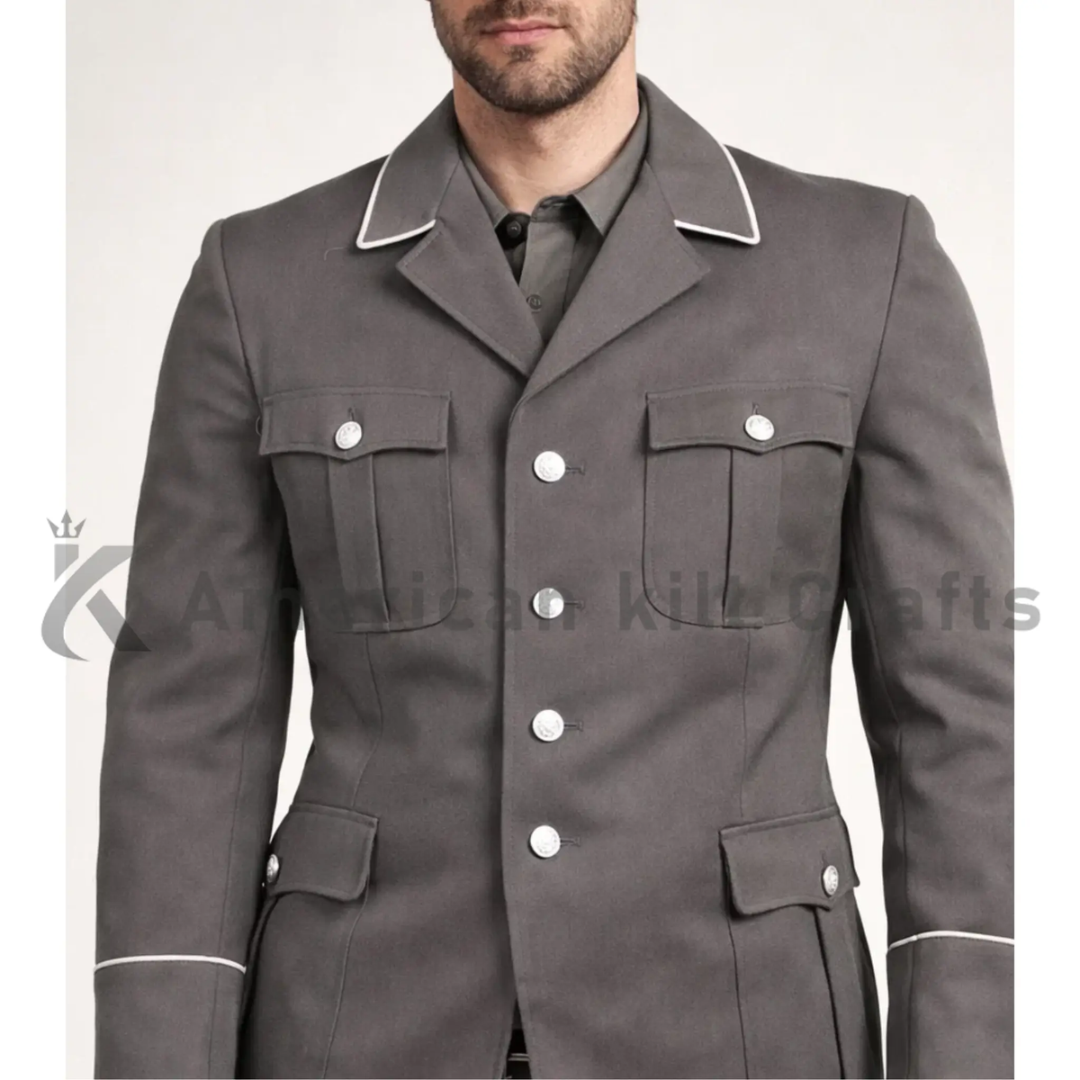 Close-up of men’s  NVA East German officer uniform showing the grey military fabric, collar, buttons, shoulder detailing and formal dress uniform construction.