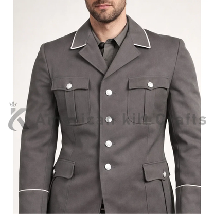 Close-up of men’s  NVA East German officer uniform showing the grey military fabric, collar, buttons, shoulder detailing and formal dress uniform construction.