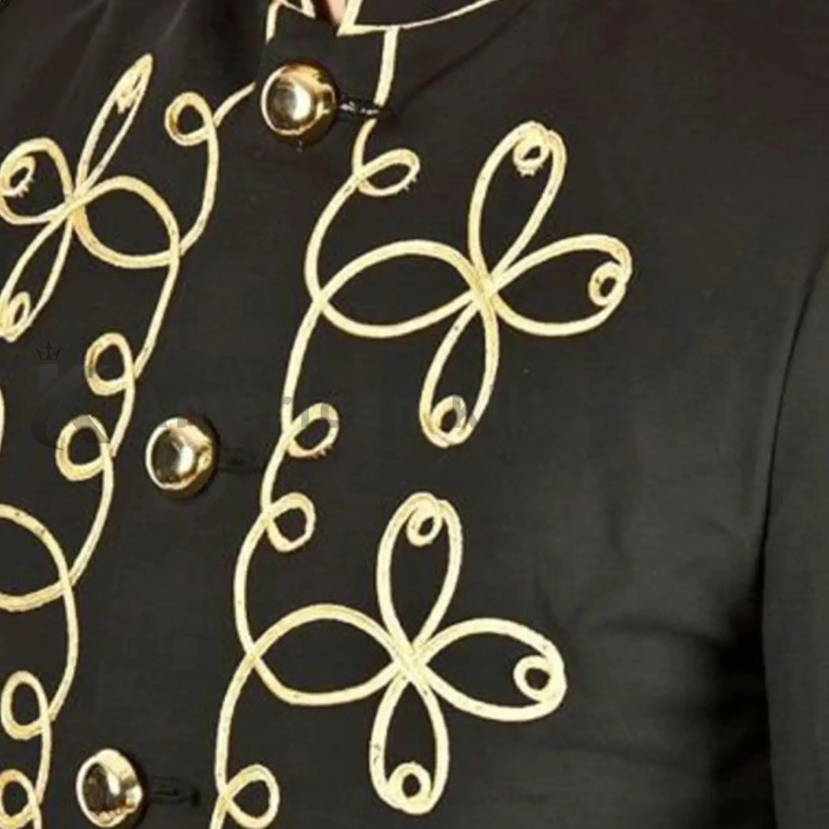 Close-up of men’s Napoleon military jacket featuring handmade gold embroidery, decorative silver buttons and detailed craftsmanship.
