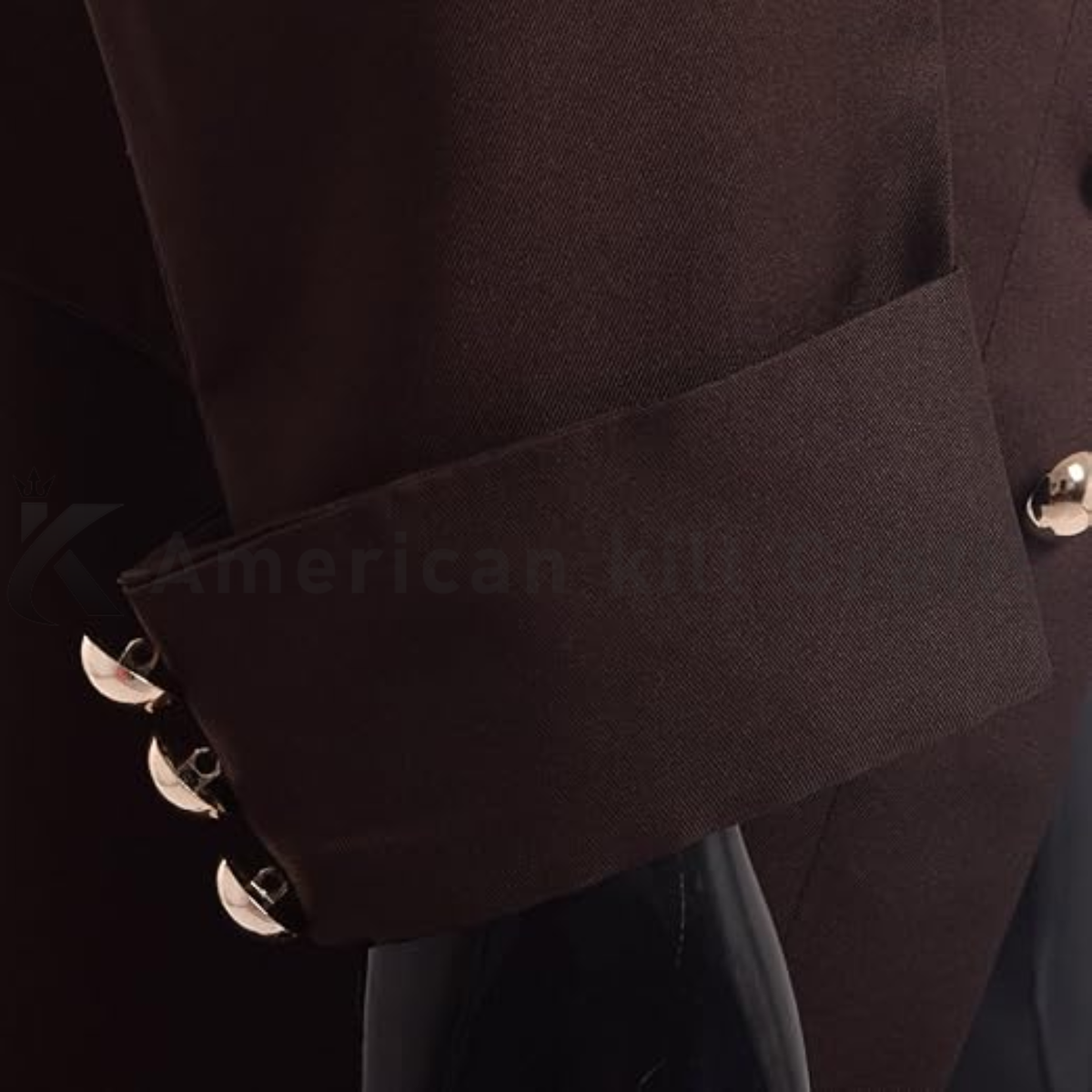 Close-up of men’s Victorian frock coat showing the lapel, button details, fabric texture and refined historical tailoring craftsmanship.