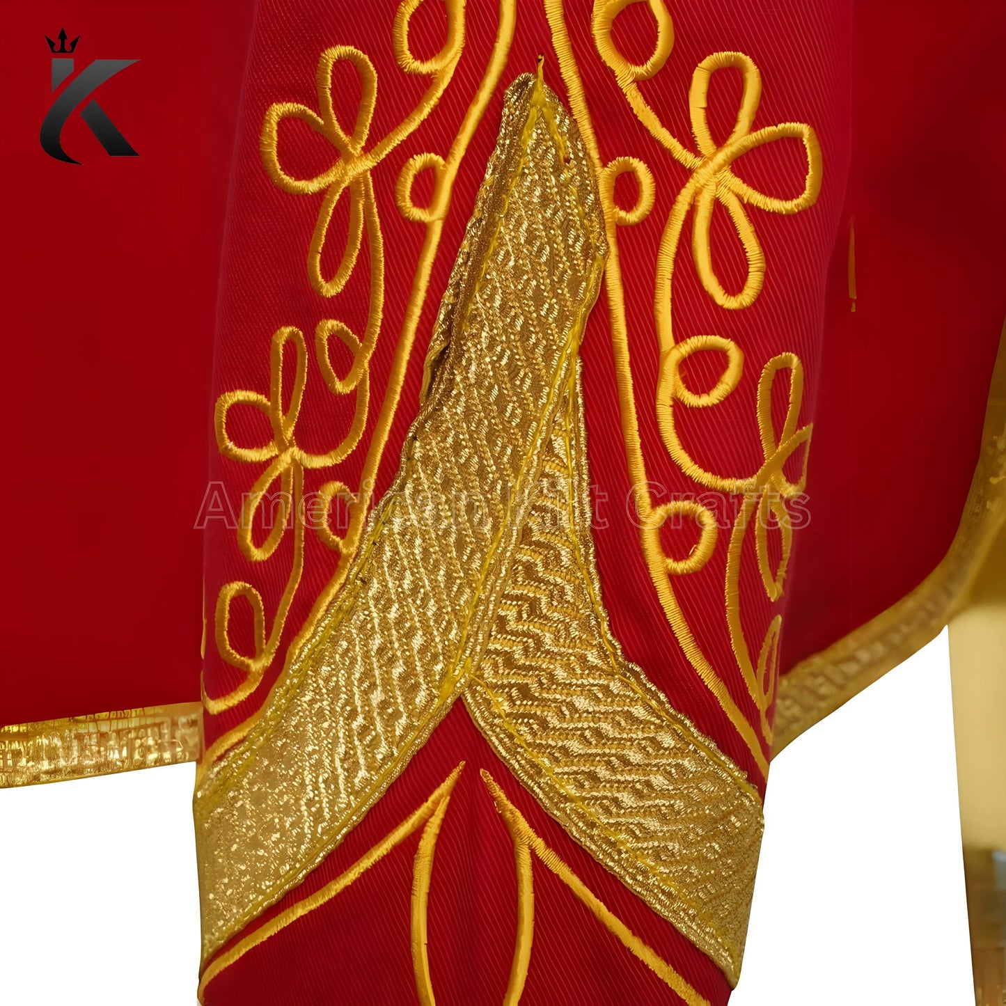 Close-up of sleeve red military drummer jacket showing decorative trim and detailed craftsmanship.
