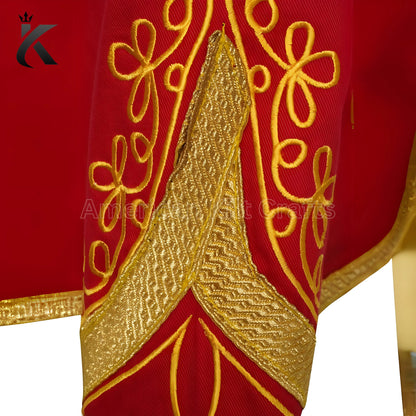 Close-up of sleeve red military drummer jacket showing decorative trim and detailed craftsmanship.