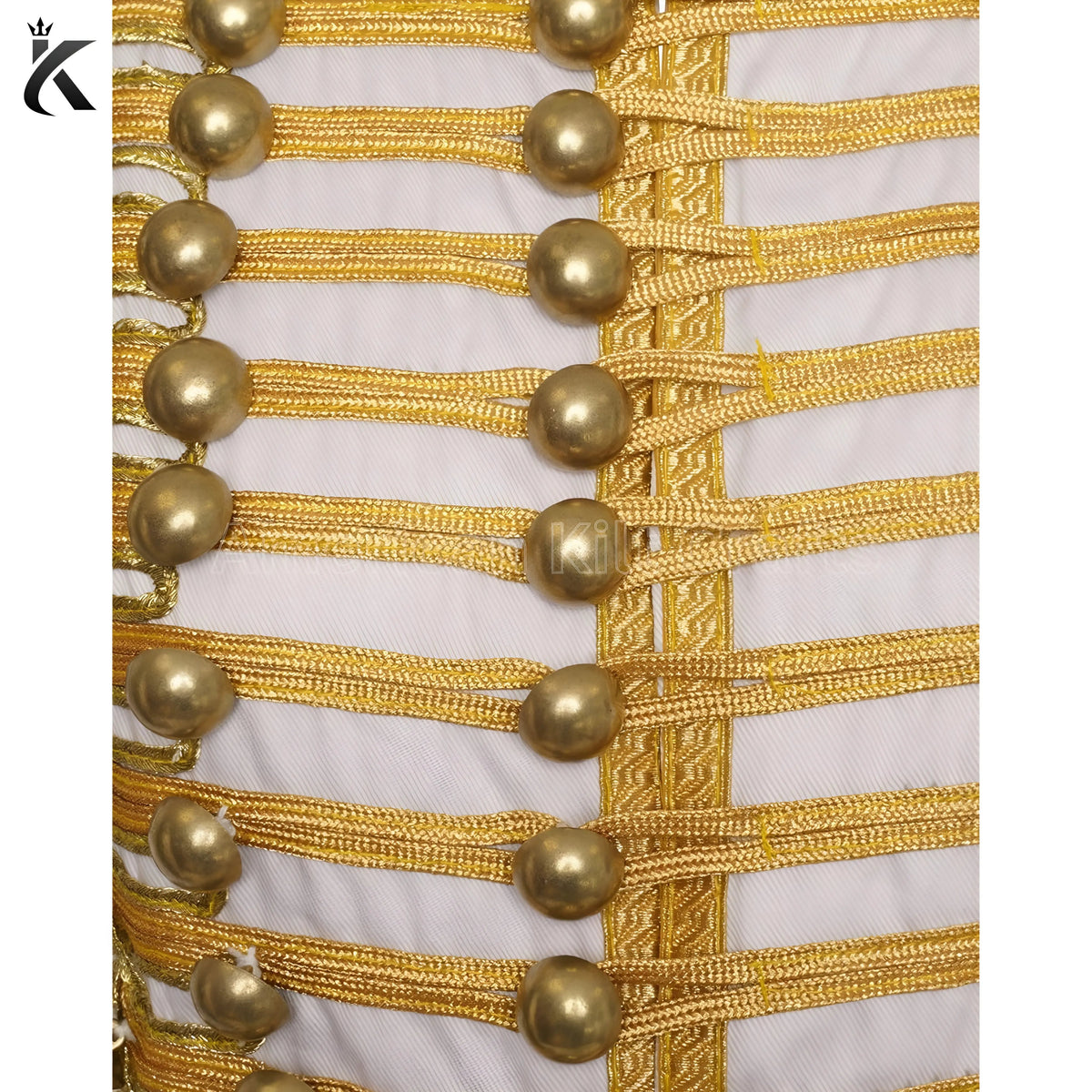 Close-up of white military drummer jacket showing decorative trim and detailed craftsmanship.