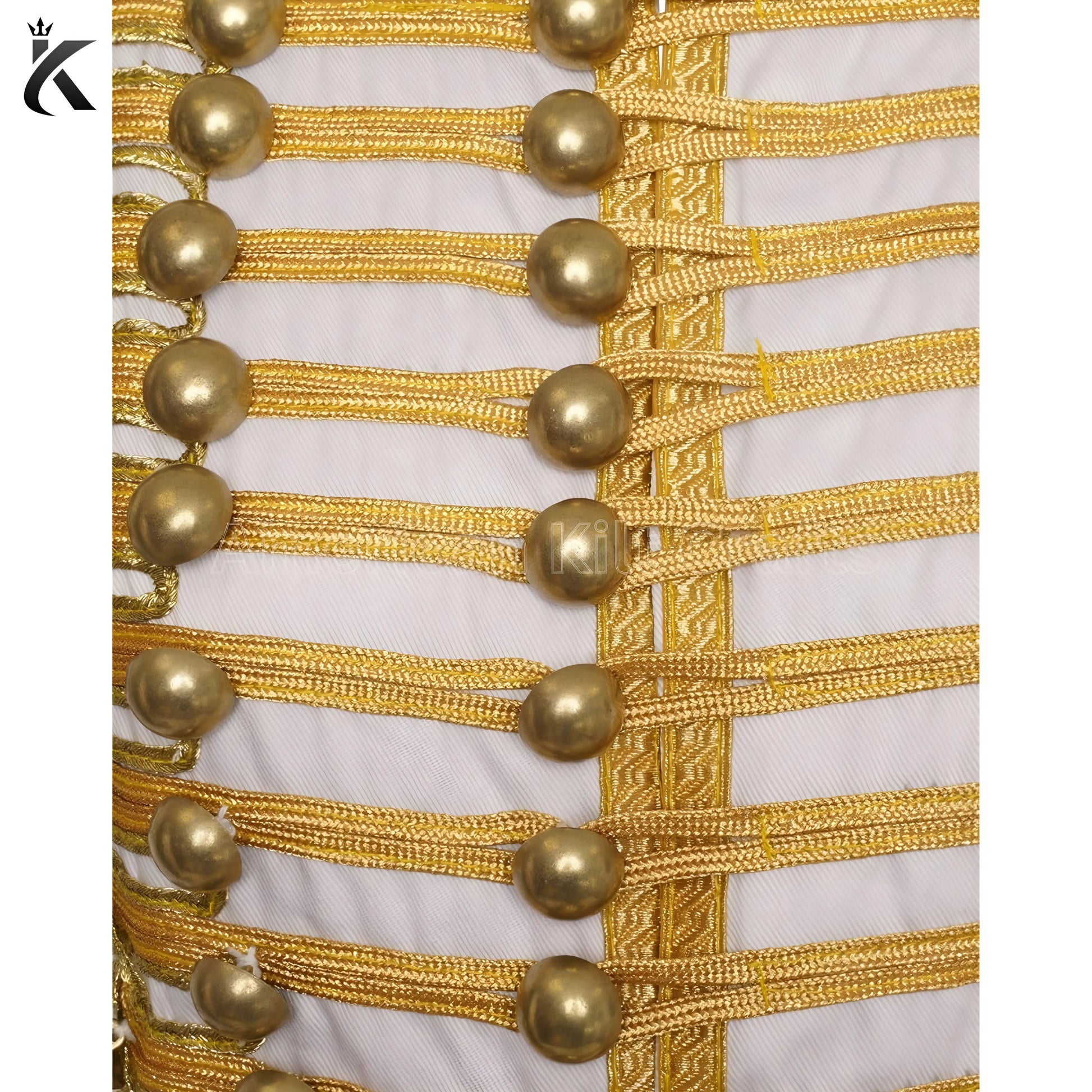 Close-up of white military drummer jacket showing decorative trim and detailed craftsmanship.