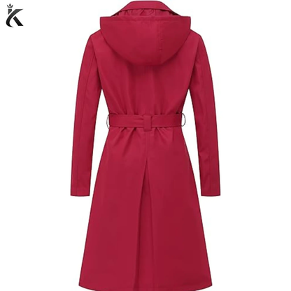 Back view of women’s double-breasted trench coat showing the detachable hood, belted waist, structured shoulders, and tailored long overcoat design.