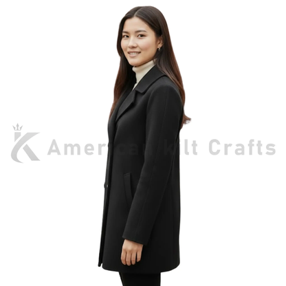 Side view of women’s black double-breasted wool coat with structured tailoring and classic winter pea coat styling.