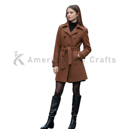 Side angle view of women’s brown double-breasted trench coat with belted waist, structured fit, and elegant winter styling.