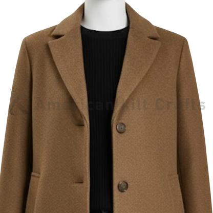Close-up of women’s camel wool blend overcoat showing the fabric texture, stitching, collar and detailed coat construction.