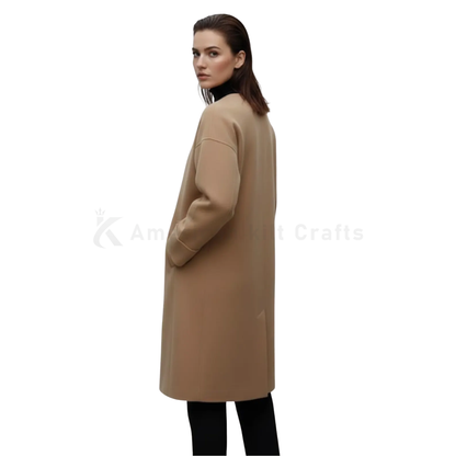 Back view of women’s camel wool overcoat featuring a clean minimalist design, straight-cut silhouette, and long winter length.