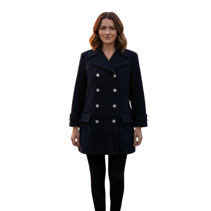 Front view of women’s rare French navy wool pea coat featuring a tailored vintage silhouette, double-breasted styling and red satin lining.