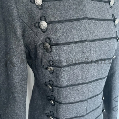 Close-up of a women’s grey Napoleon jacket displaying ornate Hussar braidwork, decorative buttons and detailed wool craftsmanship.