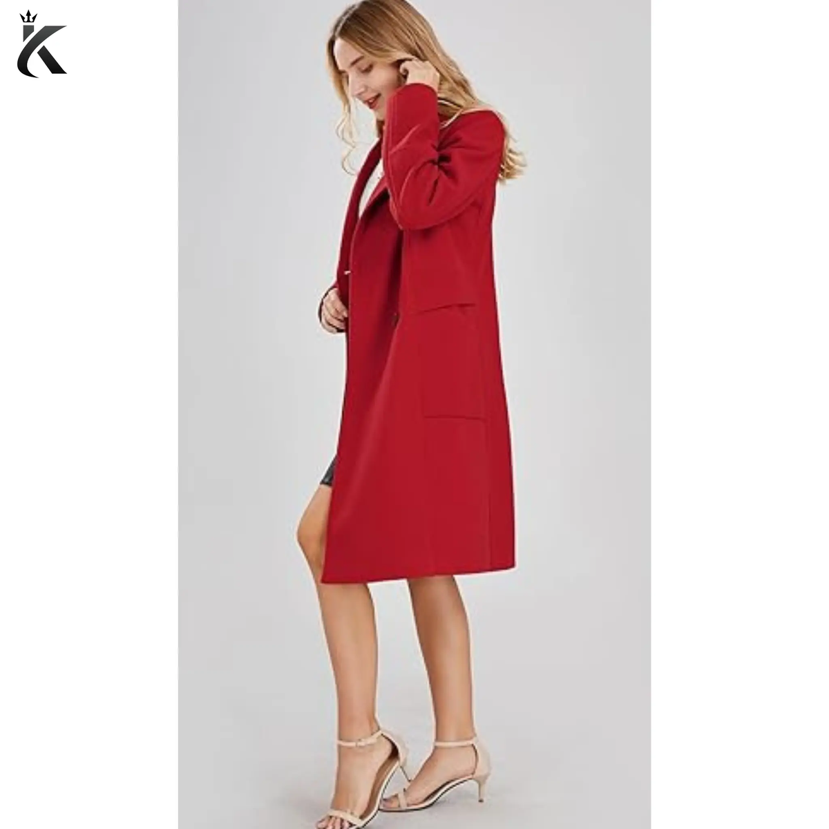 Side view of women’s double-breasted wool blend pea coat showing the structured fit, long sleeves, and classic mid-long trench coat silhouette.