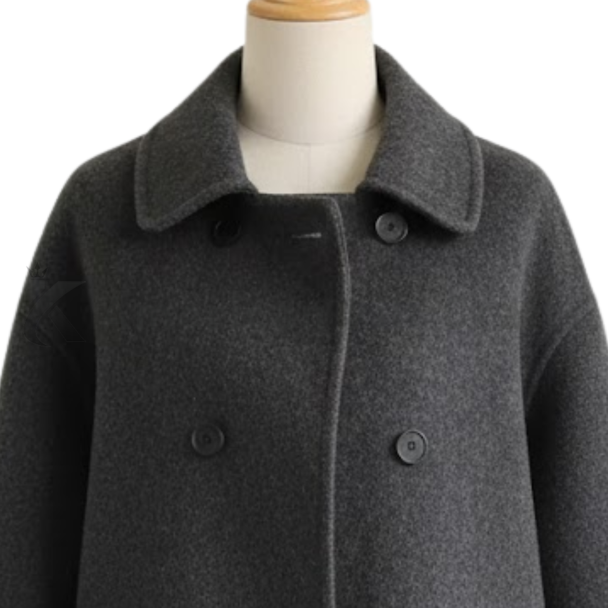 Close up of women’s wool blend pea coat showing lapels, double breasted buttons, fabric texture and tailored stitching details.