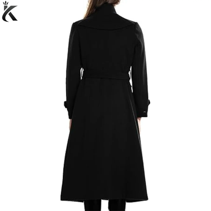 Back view of women’s long wool trench coat showing the tailored silhouette, structured shoulders, belted waist, and elegant winter overcoat design.